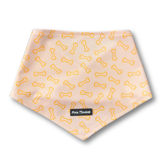 A vibrant orange dog bandana featuring a playful bone pattern. Adjustable with tie and button options for a secure and comfortable fit—perfect for any occasion!