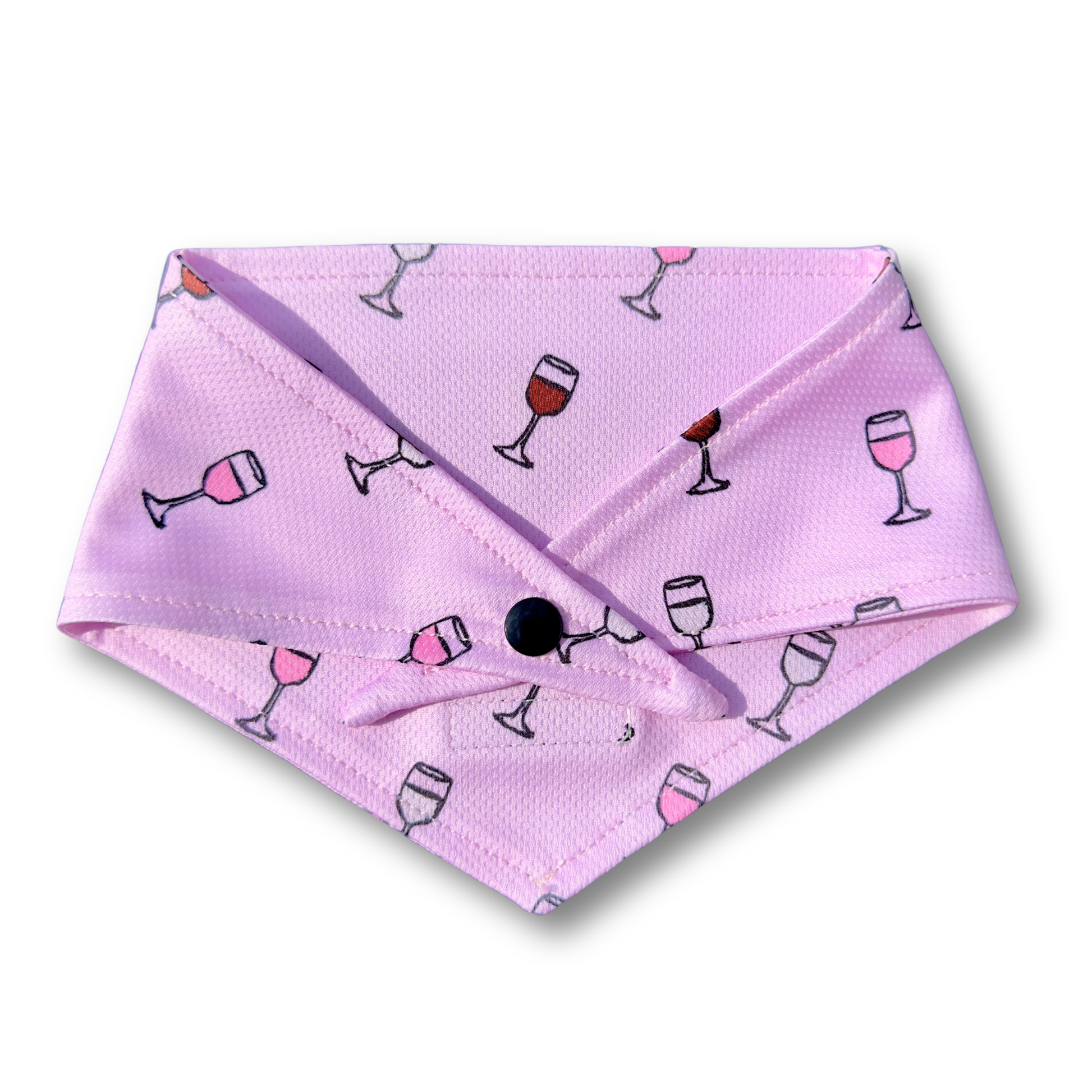 A stylish dog bandana with a wine-themed design, featuring elegant illustrations of red, white, champagne, and rosé elements. Adjustable fit with tie and button options—perfect for wine lovers!