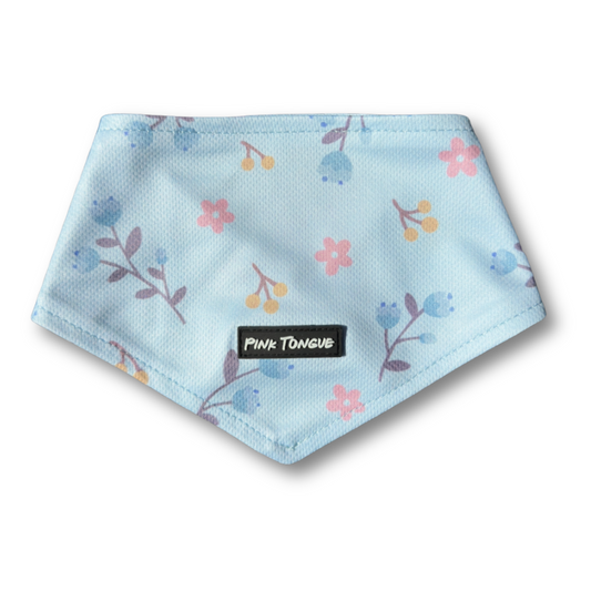 A vibrant floral dog bandana featuring soft, colorful blooms, perfect for spring. Designed for comfort and style, it offers multiple fastening options—tie, button, or both—for a secure and adjustable fit. Ideal for walks, picnics, and adding a fresh touch to your pup’s wardrobe.