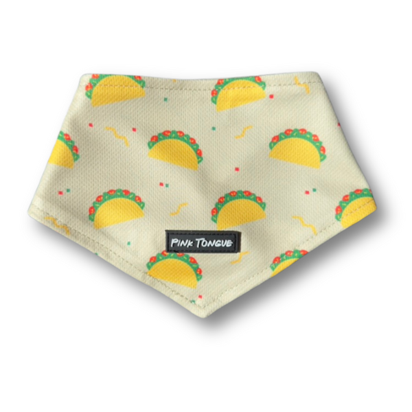 A fun and festive dog bandana featuring a colorful taco print, perfect for pups who love to celebrate Taco Tuesday in style. Designed for comfort and versatility, it can be tied, buttoned, or both for a secure and adjustable fit. Great for food-loving dogs, parties, or casual outings with a playful twist!
