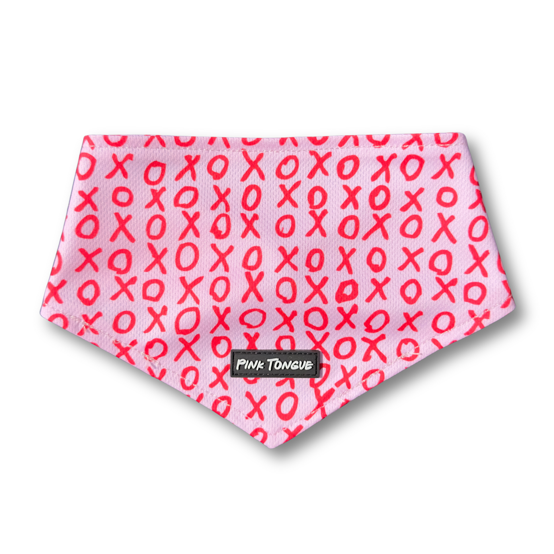 A charming Valentine's Day dog bandana featuring an XO pattern, perfect for celebrating love with your pup. Adjustable with tie and button options for a secure and stylish fit.